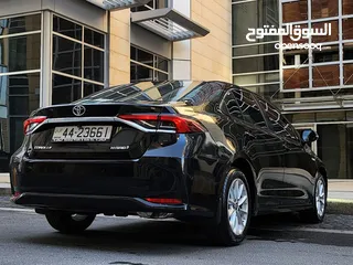  9 تويوتا كورولا هايبرد فحص كامل وارد المركزية وصيانة المركزية لون اسود مميز بحالة جيدة جدا كوشوك جديد