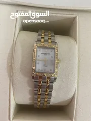  1 A Raymond Weil silver and gold ladies watch with 40 small carat diamonds.Its only been used once.