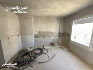  9 شقة أرضية بإطلالة مفتوحة وتشطيب مؤسس — فرصة لتصميم لمساتك الخاصة!
