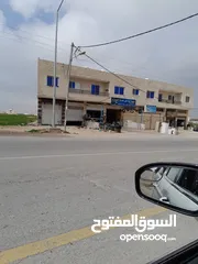  2 مجمع تجاري للبيع على قطعه ارض دونم على الشارع العام في الربه  /الروضه سعر حرق