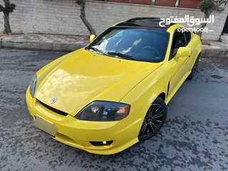  16 هونداي توسكاني شكل 2005 كامله الاضافات