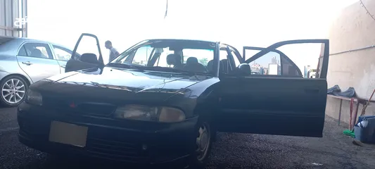  3 متسوبيشي لانسر موديل 1994 لون كحلي ترخيص طويل