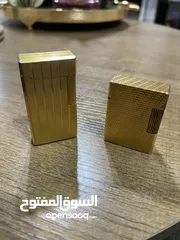  1 ولاعتين ديبونت ( s t Dupont )صناعه فرنسيه مطلي بالذهب