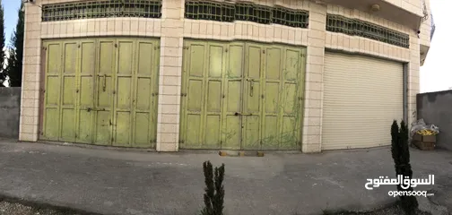  2 محلات تجارية للإيجار كمخزن بضائع قرب شارع سنجر دورا الخليل– مساحة 120م2 بثلاثة أبواب