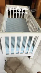  2 A Baby Cot which is barely used