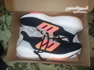  1 حذاء adidas UltraBoost 22 Black Flash Orange اصلي بنص سعره بسعر مغري جدا الفضل للمشي والراحة