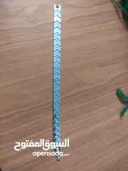  4 Stainless steel bracelet with starburst engraving. سوار ستانلس ستيل مع نقش متكرر لإنفجار نجمي