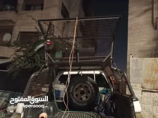  15 رول بار مع سلة وشبك (غرفة شبك) لبك اب ميتسوبيشي من موديل 2000 ولغاية 2006 بحالة الوكاله