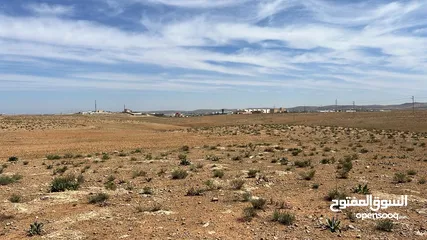  8 للاستثمار : ارض للبيع 1128 متر - جامعة العلوم والتكنولوجيا - مرتفعة مطلة وصخرية بسعر مغري
