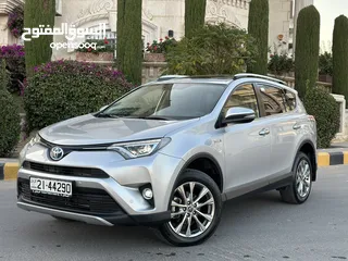  1 Toyota Rav4 2016 (Hybrid)مخزنة قاطع مسافة (14)الف كم فقط وارد المركزية تحت الكفالة