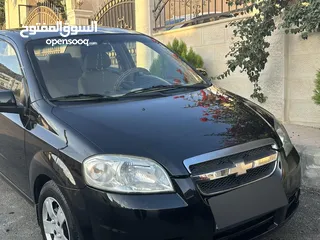  2 شفروليه افيو 2009 أسود ميتاليك للبيع بسعر مغري مؤمنة ومرخصة وليست بحاجة لأي نوع من الصيانة