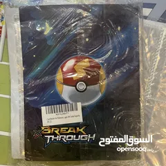  7 كروت بوكيمون والبومات (Pokemon cards and binders)
