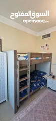  2 غرفة نوم أطفال  سرير طابقين بدون مرتبة وكومودينة وشوفونيرة وخزانة ملابس كبيرة وستائر220×100وصوفا