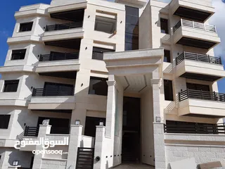  1 اخر شقة غرفتين نوم في مشروع ربوة عبدون ط ارضي مع كراج خاص و ترس كبير بأقل سعر