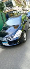  1 tida nissan 2010   تيدا   نيسان فول اوبشن لون اسود وفرش اسود  ماشيه 117,000km ABS Air bag جيدا جدا