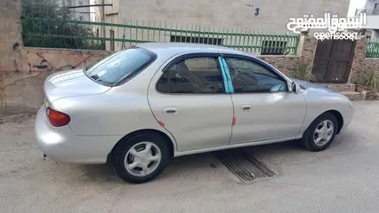  4 هونداي افانتي لون سلفر 97 فحص اربعه جيد أمامي جيد قصعات وخلفي جيدات
