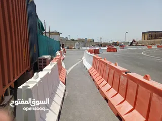  5 used plastic road barriers