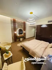  15 Two rooms and a hall for monthly rent in Ajman, overlooking the creek, new furnishings, Al Rashidiya