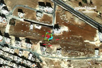  2 ارض من اراضي شمال عمان ياجوز واجهه على الشارع للبيع