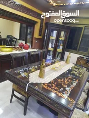  5 طاولة سفرة مع 8 كراسي تم تفصيله ومعها لوح زجاجي عازل للحراره