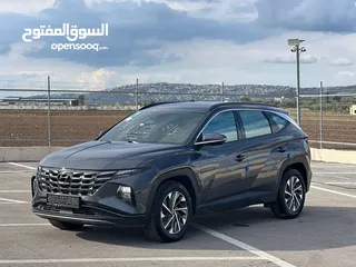  1 هونداي توسان/2022 فل الفل بدون فتحة سقف  2x4 ///240Hp بنزين + كهرباء  ( Haybrid) 1600cc