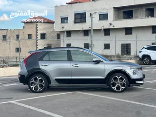  6 كايا نيرو  هايبرد (بنزين+كهرباء ) فل الفل  فتحة سقف  لون مميز اضافات مميزة /2022 جناح اسود