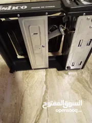  4 موقد للطبخ مستعمل مرتين فقط يعمل ب علبة غاز صغيرة على جانبه
