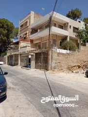  2 مخزن للبيع على شارع قرب مستشفى الوطني