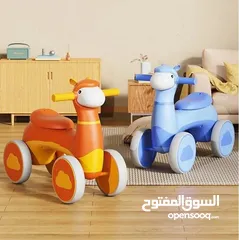  4 دراجة أطفال بأربع عجلات بشكل خروف  مع إضاءة  وموسيقى ممتعة مناسبة للأطفال من عمر سنة ونصف حتى 4 سنوا