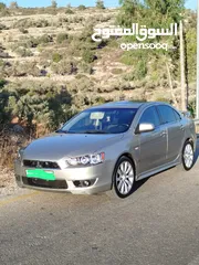  1 ميتسوبيشي لانسر موديل 2009 مطور 1800