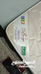  1 Queen Size Raha company medicated Bed spring mattress in Good Condition for urgent sale.