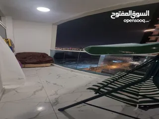  9 للايجار الشهري شقة غرفتين و صالة مفروشة في أبراج الواحة في عجمان بمنطقة الراشدية
