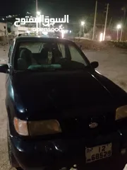  1 كيا سبورتاج موديل 2000 لون كحلي