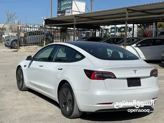  8 Tesla model 3 2023 لون آبيض لؤلؤي