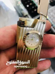  3 ولاعه سويسريه مع ساعه تعبايه عمرها ما يقارب اكثر من 60 سنه