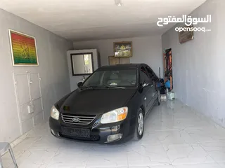  18 كيا سيراتو 2008 ماتور 1600 بنزين اوتومات عدد 2 لون ابيض ولون اسود