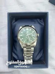  2 ساعه poloاصلي  للبيع لون اخضر