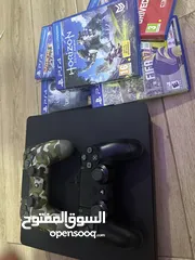  1 PlayStation 4 with 2 controllers and 5 games