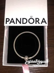 4 PANDORA bracelet, for sale, plus two charms as a gift. price for all 60 dinars