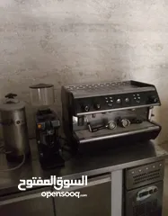  1 ماكنة اسبريسو مع مطحنة وفلتر ماء  صلاة النبي فش فيها ولا اي اشي ماكنة ممتازة جداً