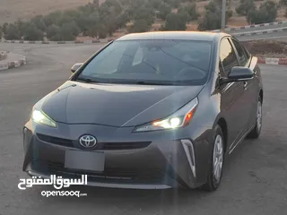  1 تويوتا بريوس 2020 حره باسم المستورد لون فيراني بطاريه ليثيوم بسعر مغري جدا