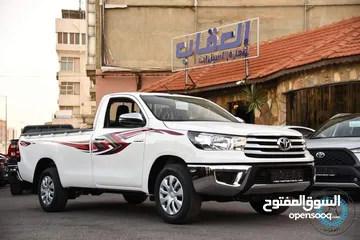  1 Toyota Hilux 2023  تويوتا هيلوكس كبينه واحده واطي 2023 جير عادي عداد زيرو كفاله الشركة