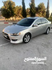  1 ميتسوبيشي لانسر 2012  اصل اسكرا ضفه  لون سكني  تحكم  كشافات زينو  جنط مغنسيوم تعتيم فرش جلد اصلي  مس
