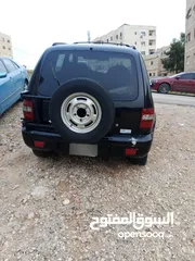  5 كيا سبورتج 2001 لون اسود للبيع