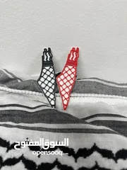  1 مديليات فلسطين مزينة بلكوفية السوداء والحمراء و التوصيل متوفر لجميع مناطق فلسطين