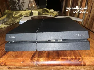  2 PlayStation 4 with a controller