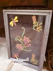 22 لوحات  رسم زيتي.. وتطريز