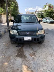  1 هوندا cr-v لون زيني موديل 2001 بداعي السفر