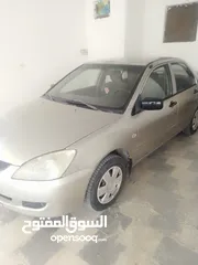  4 ميتسوبيشي لانسر موديل 2005 قير عادي للبيع