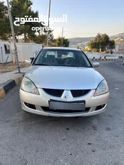  1 ميتسوبيشي لانسر 2006 وارد لكويت للبيع كاش